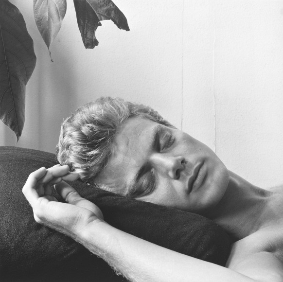 White male with eyes closed in 3/4 view.