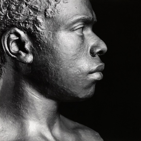 Sculpture of man in profile.