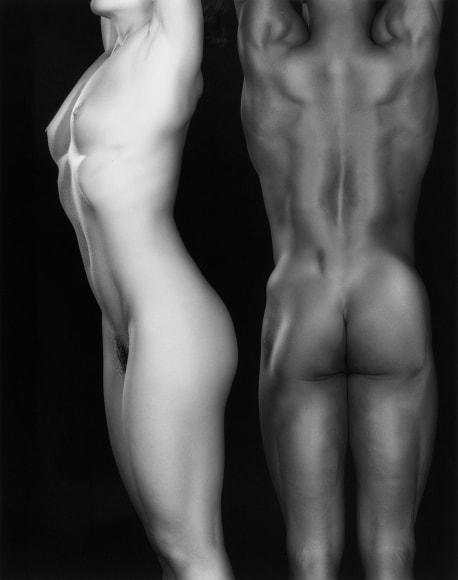 Ken and Lydia--both nude--with arms up.