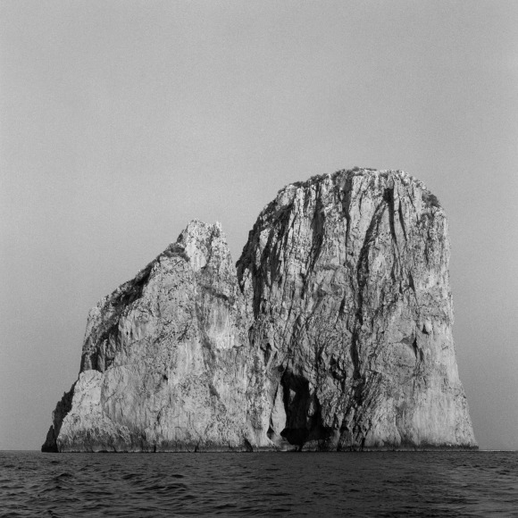 Mountain in background, water in foreground.