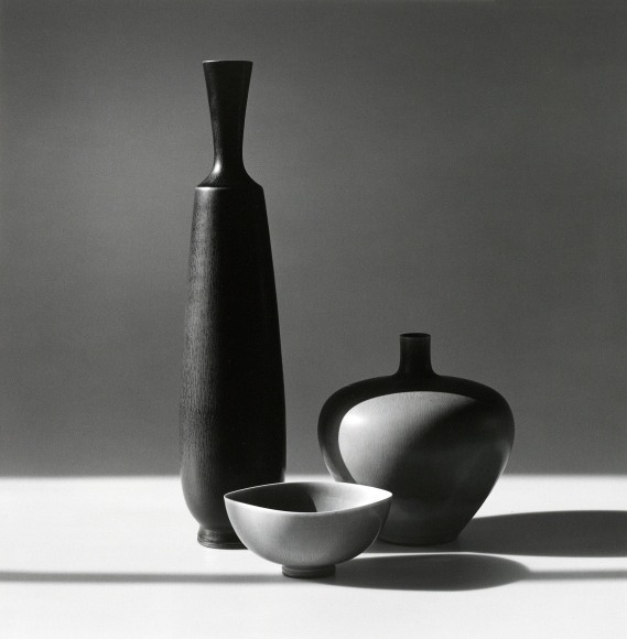 Three glass objects arranged.