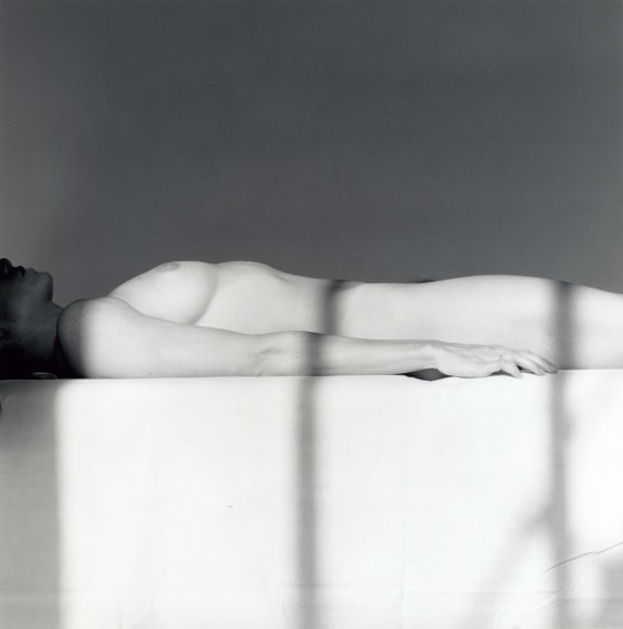 Lisa Lyon lying down, nude.