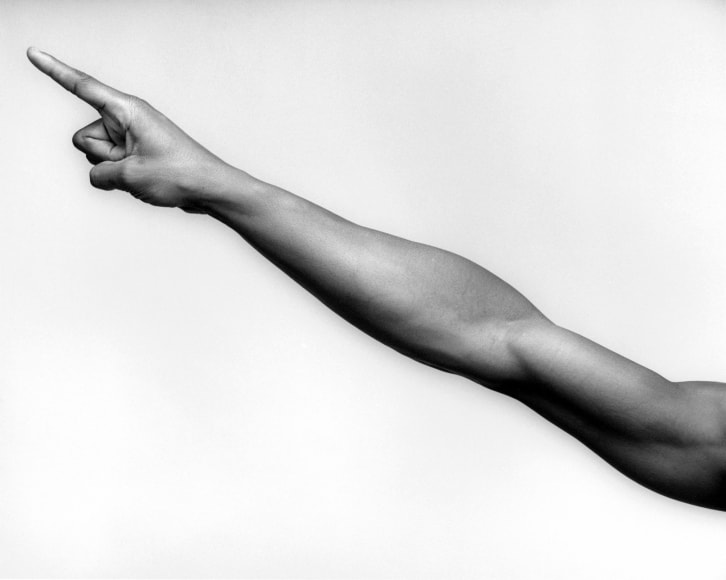 Portrait of Ken Moody's arm with outstretched finger.