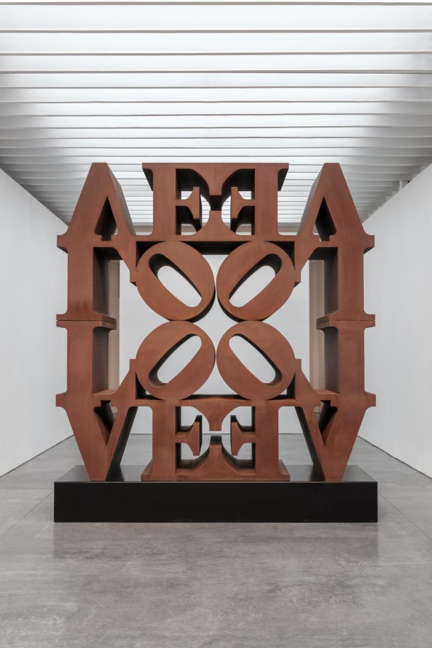 LOVE Wall, a 12 foot Cor-Ten steel sculpture consisting of four quadripartite LOVEs, two upright, two inverted, all facing inward with the four &ldquo;O&rdquo;s meeting in the center.