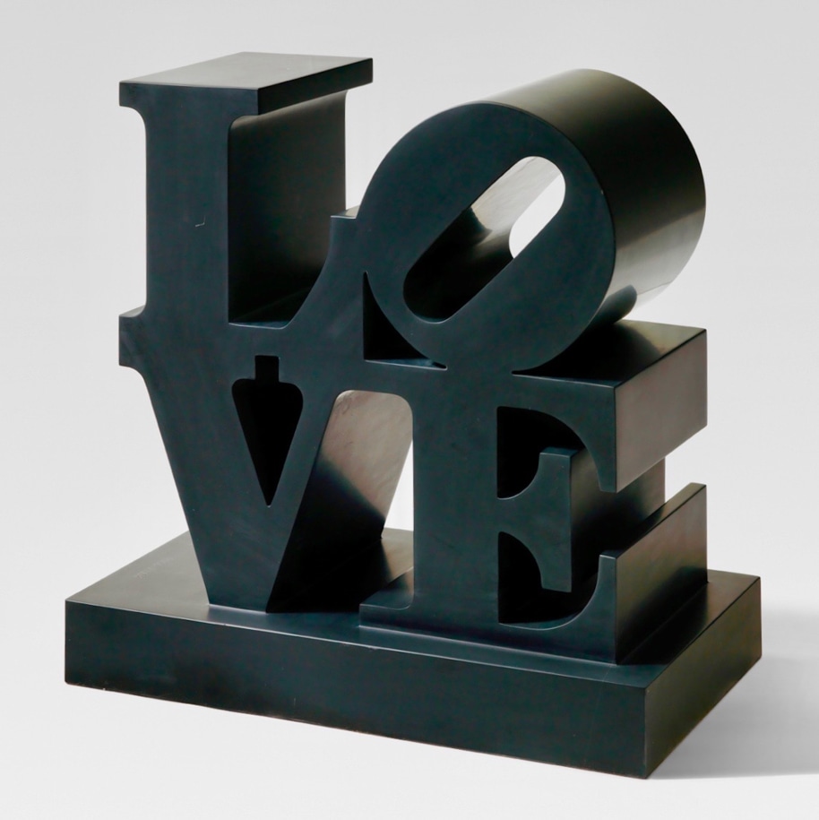 LOVE is a 22 15/16 by 23 5/16 by 13 3/16 inch black marble sculpture with the letters L and a tilted O stacked above the letters V and E.