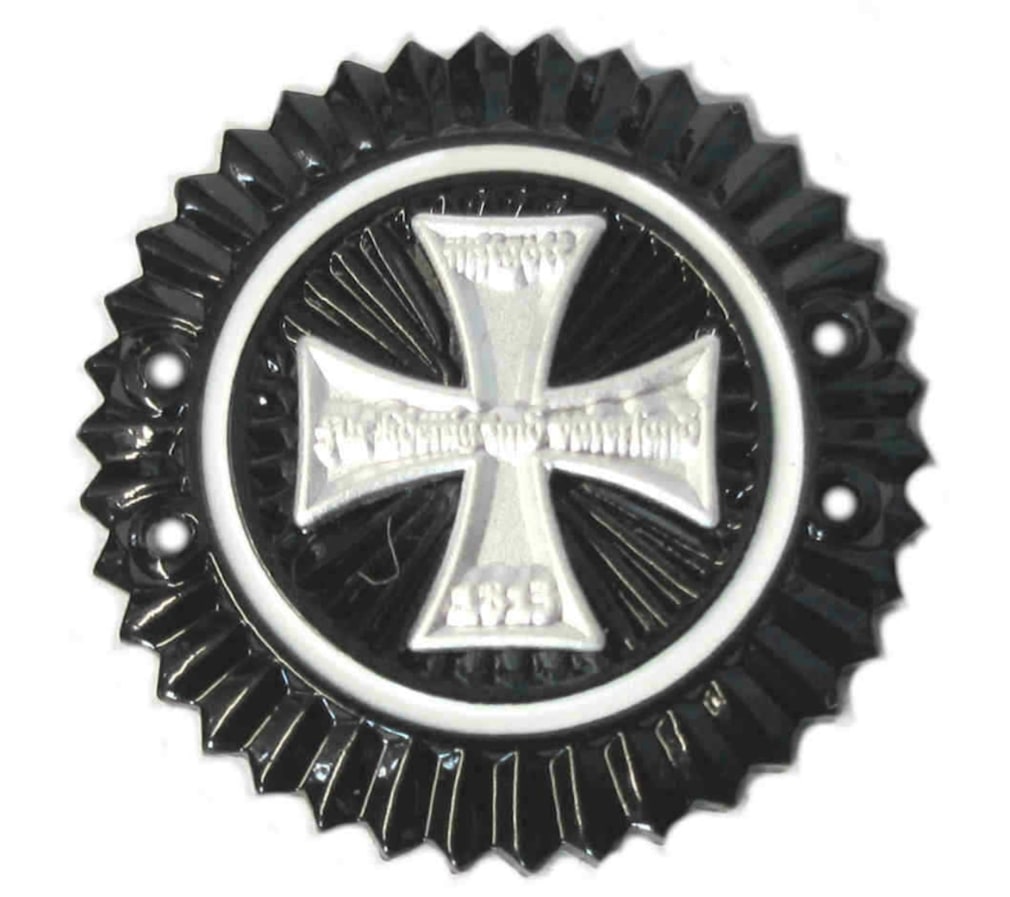 The two circular designs in the center of KvF XI (Hartley Elegy) (1989&ndash;94)&nbsp;suggest the cockades worn by members of the German Imperial army, such as this World War I Prussian Reserve cockade