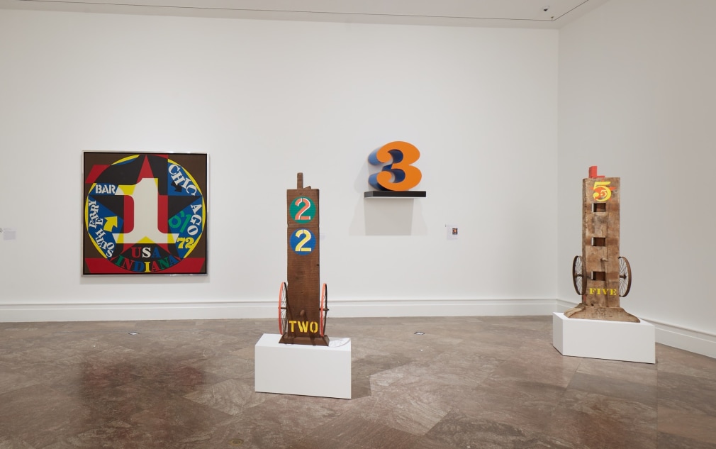 Installation view of Robert Indiana: A Sculpture Retrospective at the Albright-Knox Gallery of Art, Buffalo, New York, 2018. Left to right, Decade: Autoportrait 1961&nbsp;(1977), Two (1960&ndash;62, cast 1991), THREE (1978&ndash;2003), and Five (1984), &nbsp;