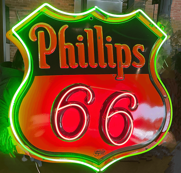 A vintage Phillips 66 red and green neon sign