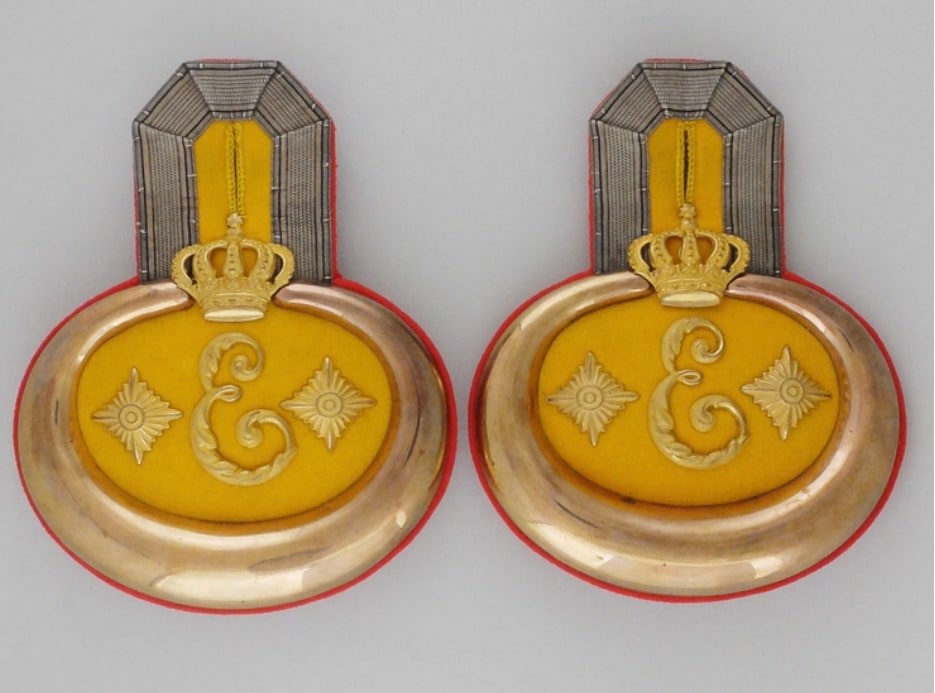 A pair Of Prussian 3rd Regiment, Queen Elisabeth Grenadier Guards epaulettes. A design resembling an epaulette with the regimental &quot;E&quot; can be seen in the lower right hand side of KvF IV