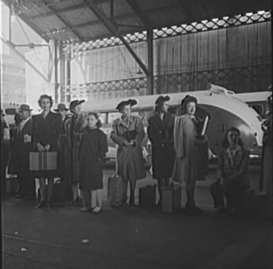 Passengers waiting for a bus at the Greyhound Bus Station, Indianapolis, 1943. Photo by Esther Bubley