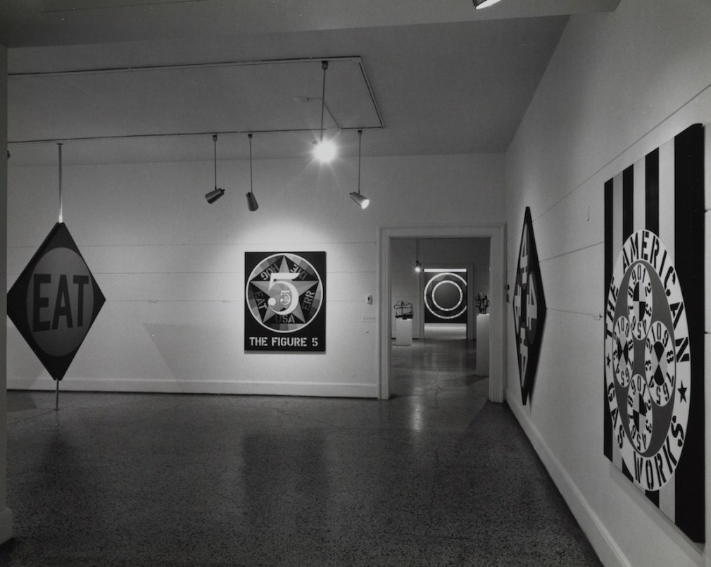 Installation view of Richard Stankiewicz, Robert Indiana, at the Walker Art Center, Minneapolis, October 22&ndash;November 24, 1963. Left to right, The Green Diamond Eat/The Red Diamond Die&nbsp;(1962),&nbsp;The Figure 5&nbsp;(1963),&nbsp;Year of Meteors&nbsp;(1961) in the distance,&nbsp;The Big Four&nbsp;(1963), and&nbsp;The American Gas Works&nbsp;(1961). Courtesy of Archives of American Art, Smithsonian Institution. Jan van der Marck papers, 1942-2010. Archives of American Art, Smithsonian Institution.