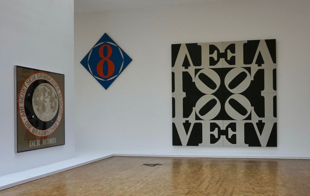 Installation view of&nbsp;Ludwig Goes Pop, Museum Ludwig, Cologne, October 2, 2014&ndash;January 11, 2015. Left to right,&nbsp;Der Mond &ndash; Die Braunschaft (1969), The Big 8 (1962), and&nbsp;Love Rising (The Black and White Love) (1968)