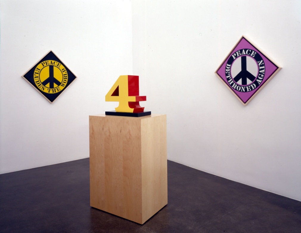 Installation view of&nbsp;Robert Indiana: New Paintings and Sculptures, Michael Kohn Gallery, Los Angeles,&nbsp;September 19&ndash;October 25, 2003. Left to right, Peace Eludes the World (2003), FOUR (1978&ndash;2003), and Peace Dethroned Again (2003).