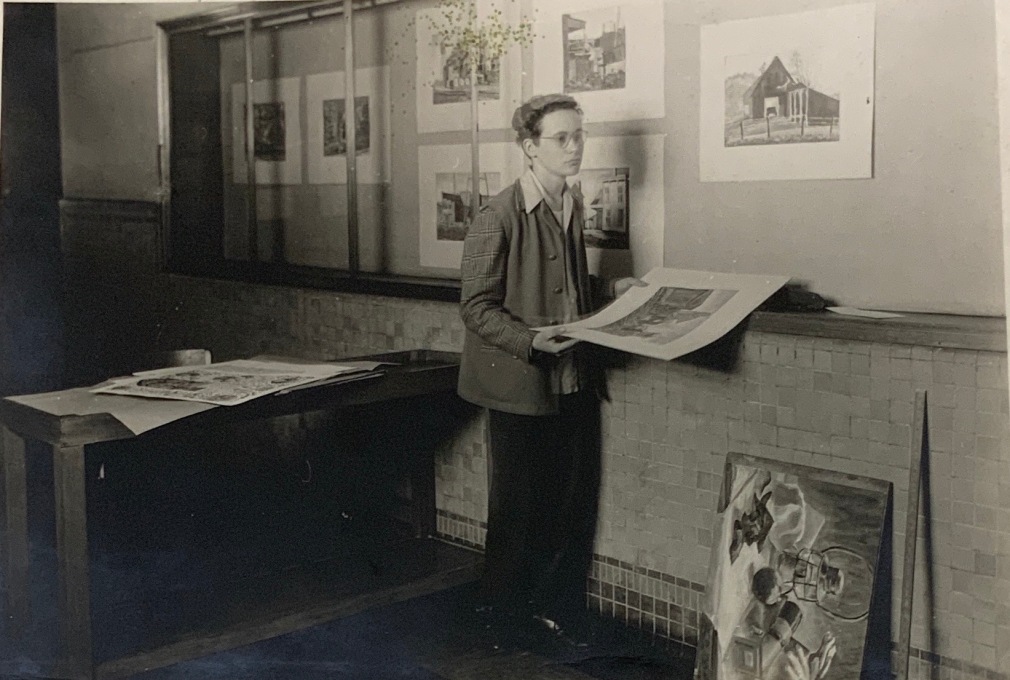 Robert Indiana (then known as Robert Clark) hanging an exhibition of watercolors at Arsenal Technical High School, 1945, &nbsp;