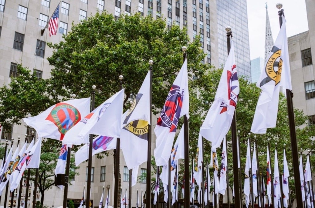 Flags featuring Indiana&#039;s Peace Paintings, including Peace: A Broken Dream, on display in Rockefeller Center,&nbsp;September 13&ndash;October 23, 2023