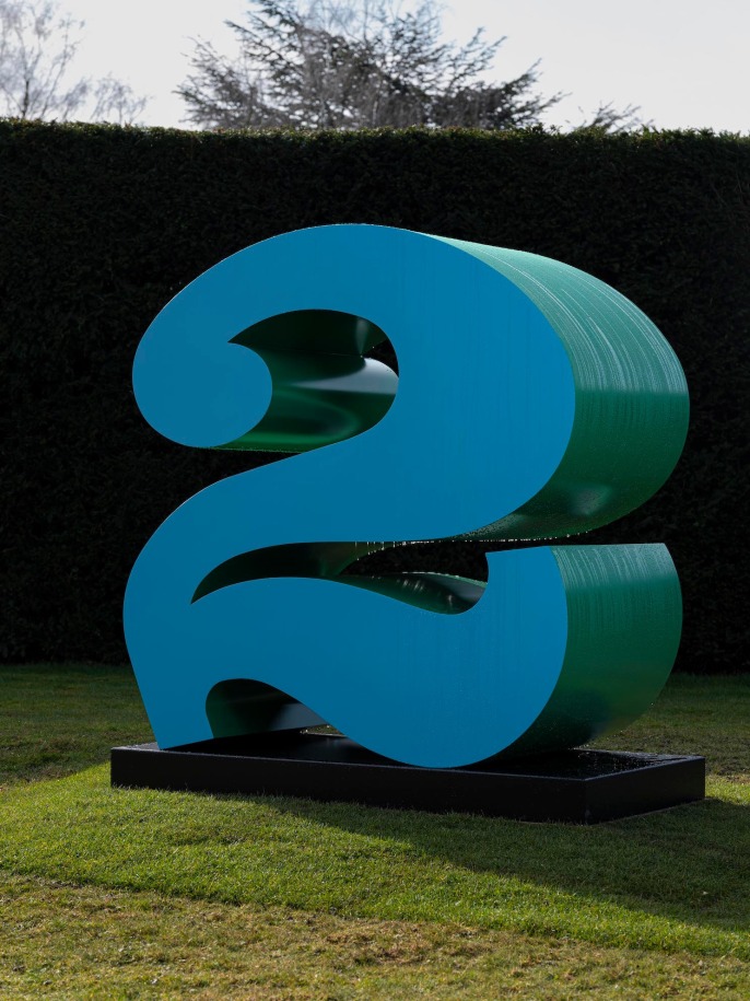 Installation view of Indiana's blue and green polychrome aluminum TWO at Yorkshire Sculpture Park