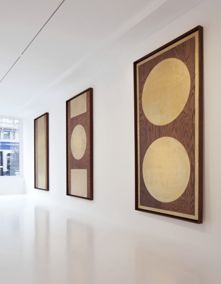 Installation view of&nbsp;Robert Indiana: Rare Works from 1959 on Coenties Slip, Galerie Gmurzynska, Zurich,&nbsp;June 12&ndash;September 20, 2011. Left to right, Slip (1959), One Golden Orb (1959/2001), and Two Golden Orbs (1959/2001)