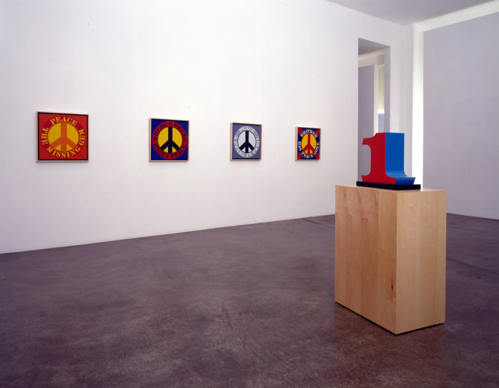 Installation view, Robert Indiana: New Paintings and Sculptures, Michael Kohn Gallery, Los Angeles, September 19&ndash;October 25, 2003. Left to right, Peace: The Missing Gem (2003), Where O Where Hides Peace (2003), Peace: A Pearl in Peril (2003), Whither Has Peace Gone (2003), and ONE (1978&ndash;2003).