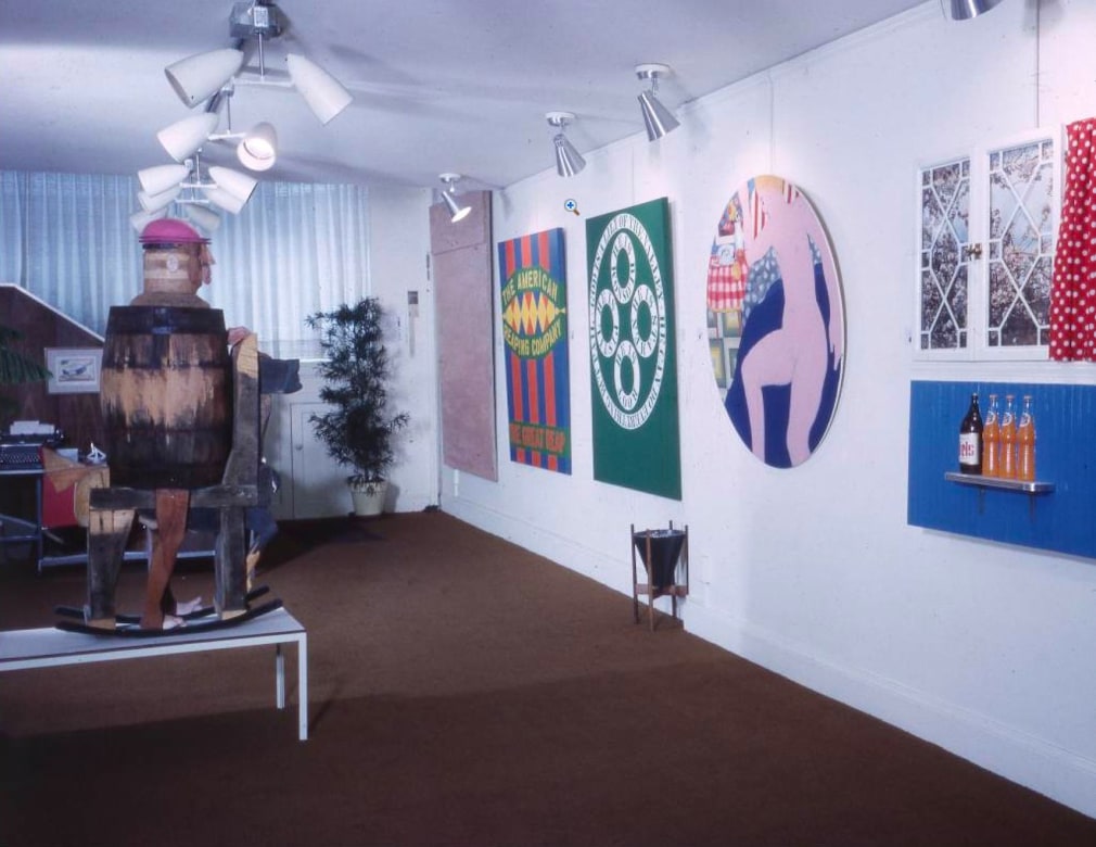 Installation view of Stock Up for the Holidays: An Anthology of Pop Art, Pace Gallery, Boston, December 10, 1962&ndash;January 2, 1963. Indiana&rsquo;s The Great Reap (1961) and God Is a Lily of the Valley (1961) are seen (second and third from the left) on the wall, &nbsp;