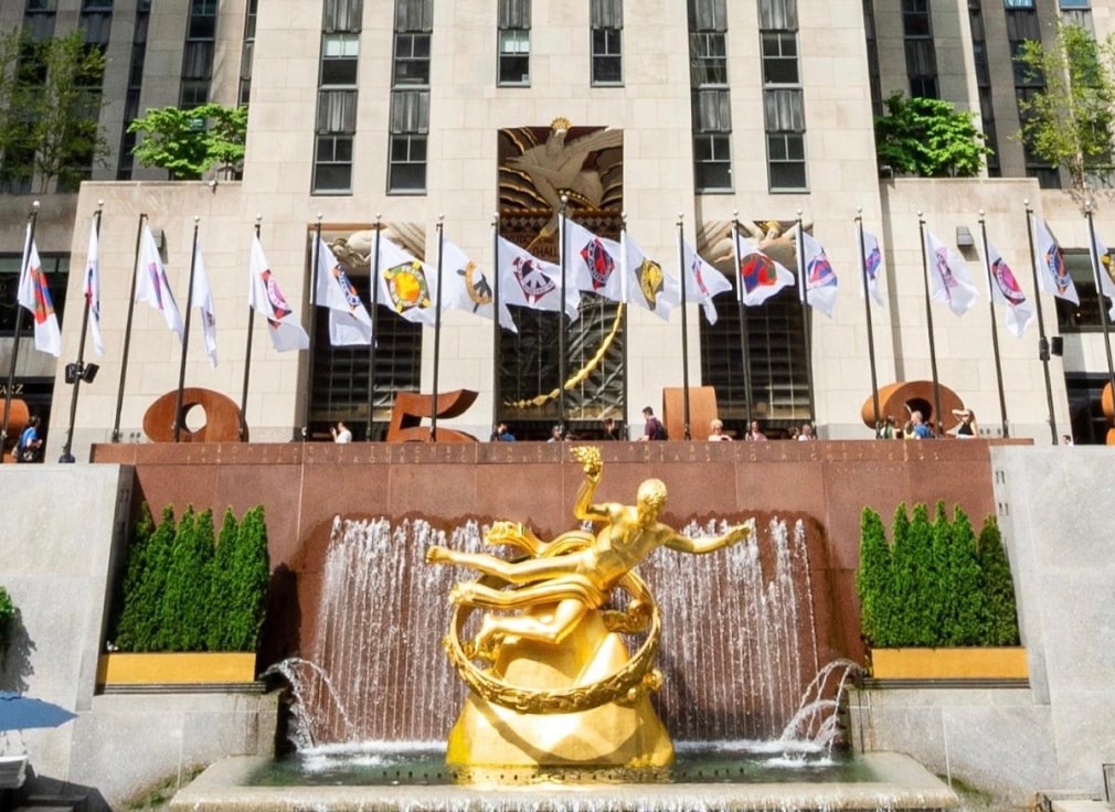 Flags featuring Indiana&rsquo;s&nbsp;Peace Paintings, including&nbsp;Peace: The Missing Gem, on display in Rockefeller Center,&nbsp;September 13&ndash;October 23, 2023