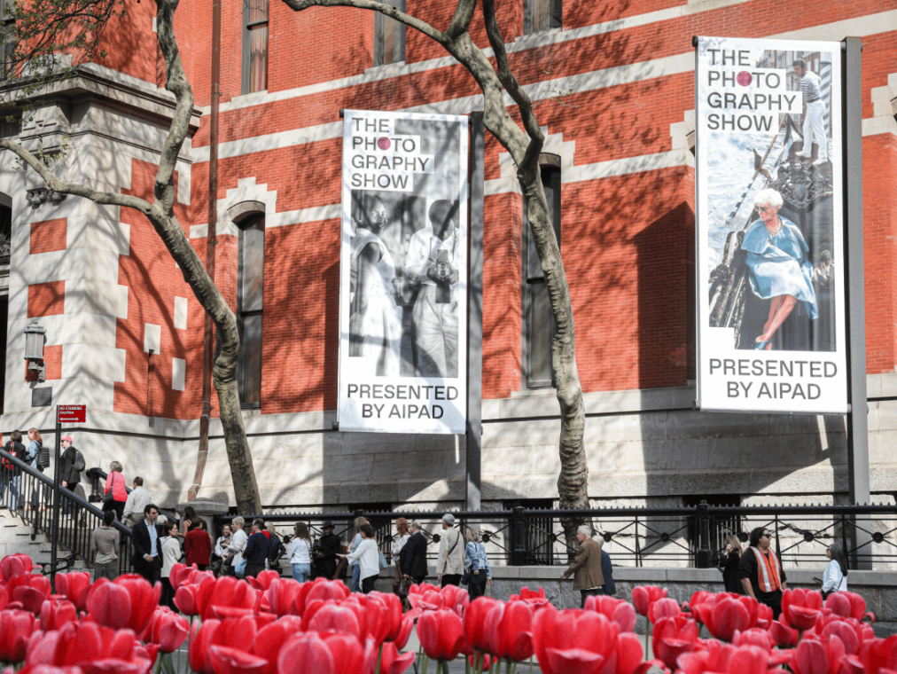 Fresh pink tulips and banners outside the Park Avenue Armory at The Photography Show 2025