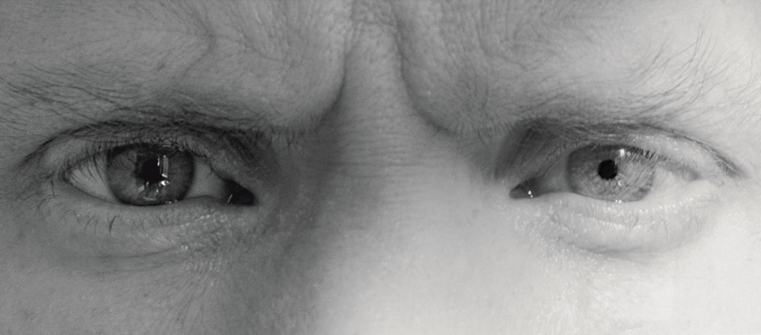 cropped image of Robert Mapplethorpe's eyes with furrowed brows