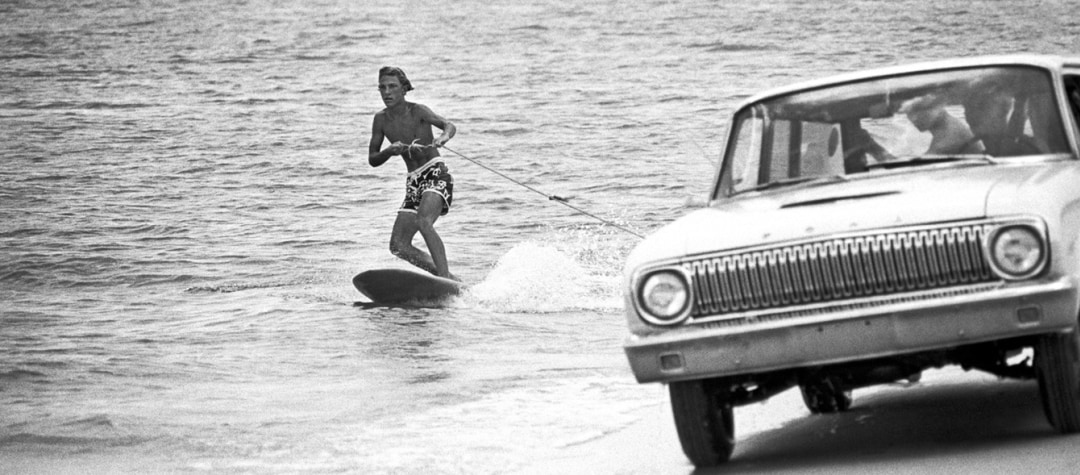 Al Satterwhite surfer being towed by car