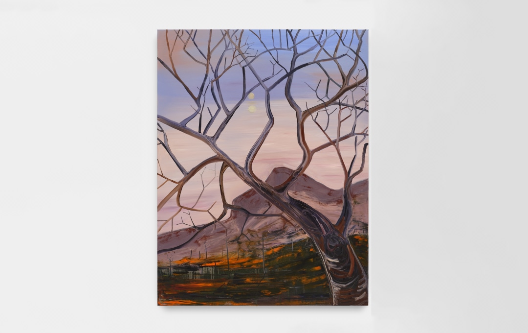 A painting depicting a barren tree in the foreground with smoldering hills in the background.