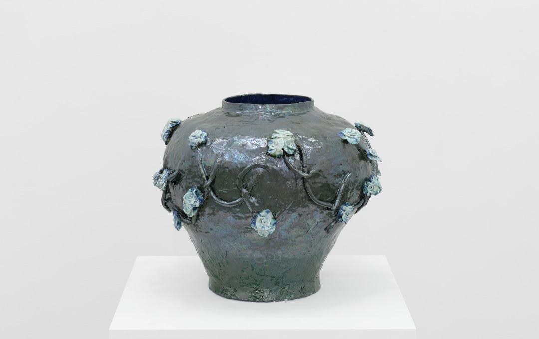 Detail of a ceramic vessel with floral motifs. 