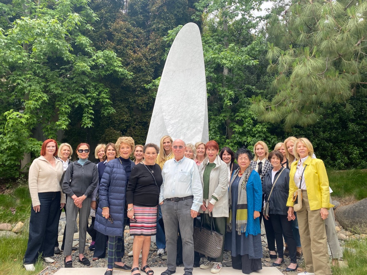 19 Visionaries with Charlie in front of his large-scale sculpture, Flight.