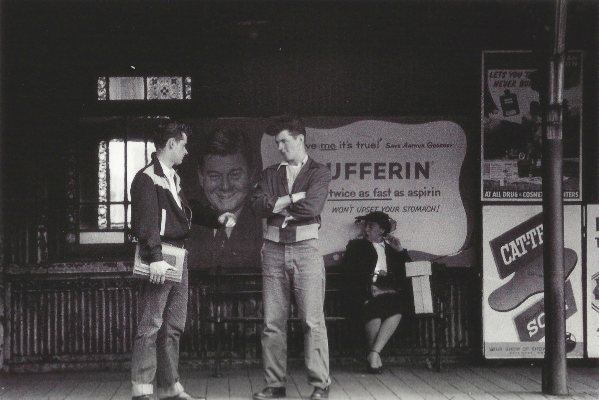 Men waiting for train by Vivian Cherry