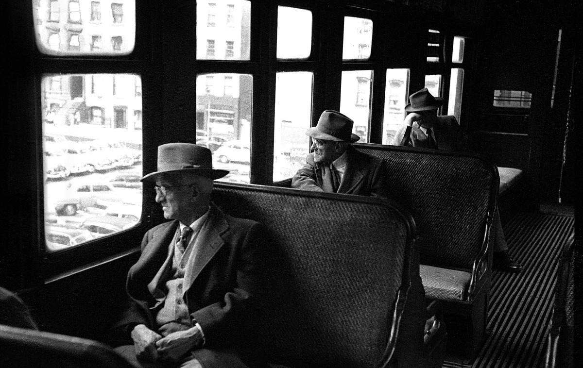 Three men on train by Vivian Cherry