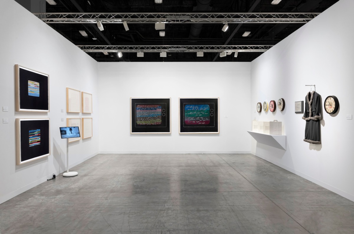 Mimi Smith: Breaking News, Art Basel Miami Beach, booth installation image featuring Television Drawings, Clocks, artist books, and garment sculpture installation