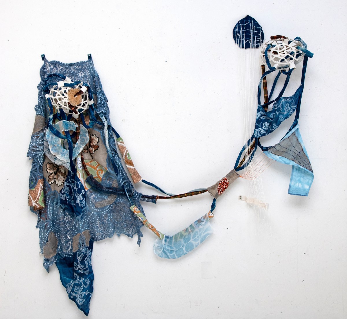 Fran Siegel, Disperesed Painting-Ida, 2024, pigment, indigo, cyanotype, embroidery, string, quilted fabric, porcelain and wood mounts, 88 x 100 x 12 in. (223.5 x 254 x 30.5 cm)