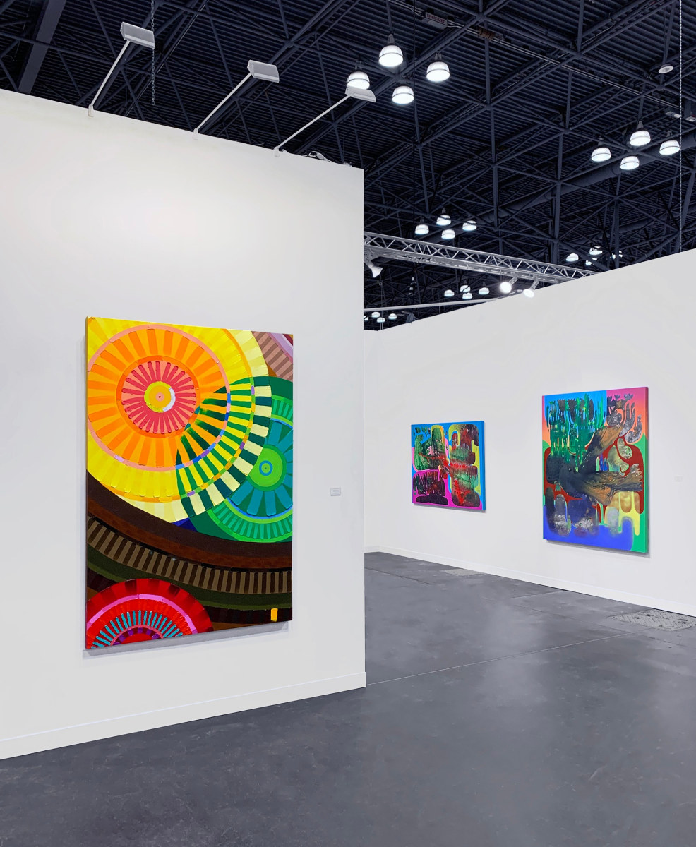 Installation view with a June Edmonds painting on the left, and Vian Sora paintings on the right.
