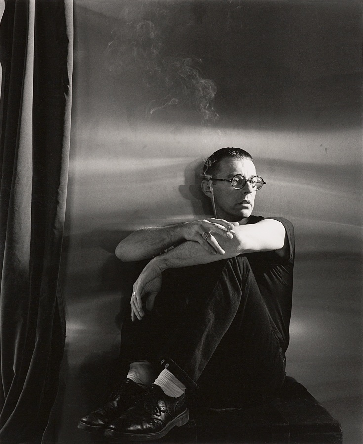 Man sitting on table by Stephen Barker