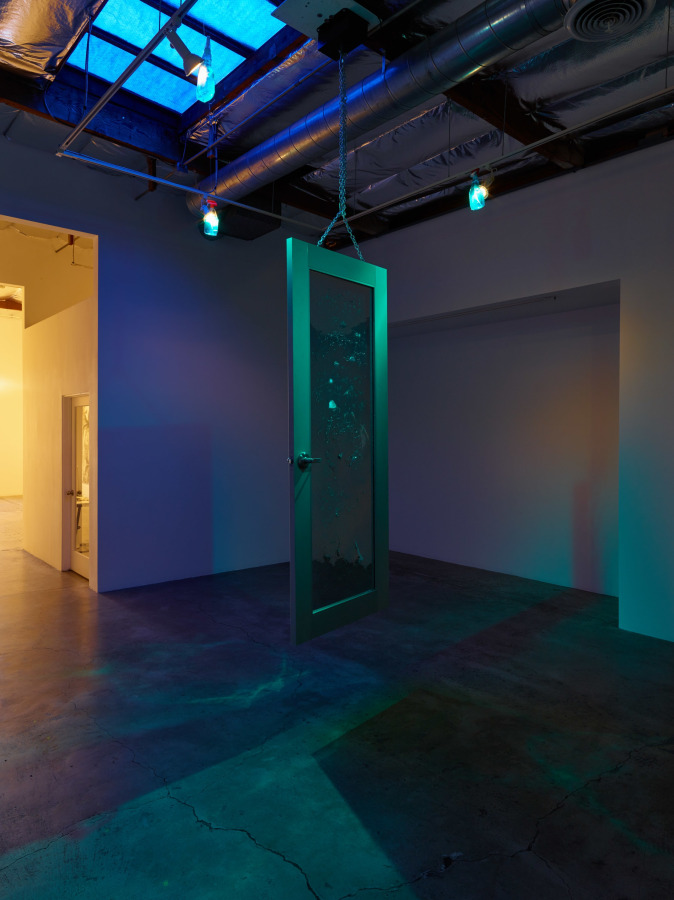 Josh Reames and Jos&eacute; Lerma Monument to Wilson and Kelling, 2016 Mirrored door, steel chain, motor, cleaning supply bottles, spotlights Dimensions variable