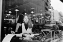Frank Paulin -  Woman in cafe window, Paris, France, 1995  | Bruce Silverstein Gallery