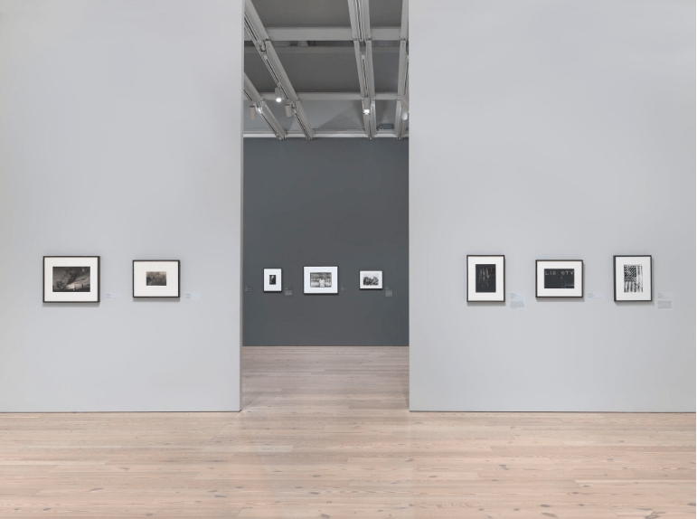 Installation view of Working Together: The Photographers of the Kamoinge Workshop (Whitney Museum of American Art, New York, November 21, 2020–March 28, 2021). From left to right: Adger Cowans, Far and Away, 1970; Herman Howard, New York, 1960s; C. Daniel Dawson, Gibson’s Victory, 1970; Ming Smith, America Seen through Stars and Stripes, New York City, New York, 1976; Beuford Smith, Angela Davis Rally, Central Park, NYC, 1972; Louis Draper, Congressional Gathering, 1959; Anthony Barboza, Pensacola, Florida, 1966; Adger Cowans, Jackson Mississippi, 1963. Photograph by Ron Amstutz