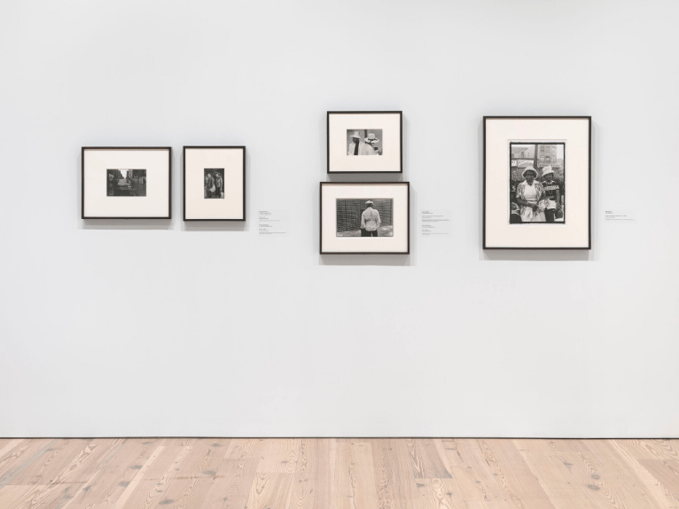 Installation view of Working Together: The Photographers of the Kamoinge Workshop (Whitney Museum of American Art, New York, November 21, 2020–March 28, 2021). From left to right, top to bottom: Al Fennar, Caddy, 1965; Anthony Barboza, NYC, c. 1970s; Shawn Walker, Easter Sunday, Harlem (125th Street), 1972; Anthony Barboza, NYC, c. 1970s; Ming Smith, Amen Corner Sisters, Harlem, NY, c. 1976. Photograph by Ron Amstutz