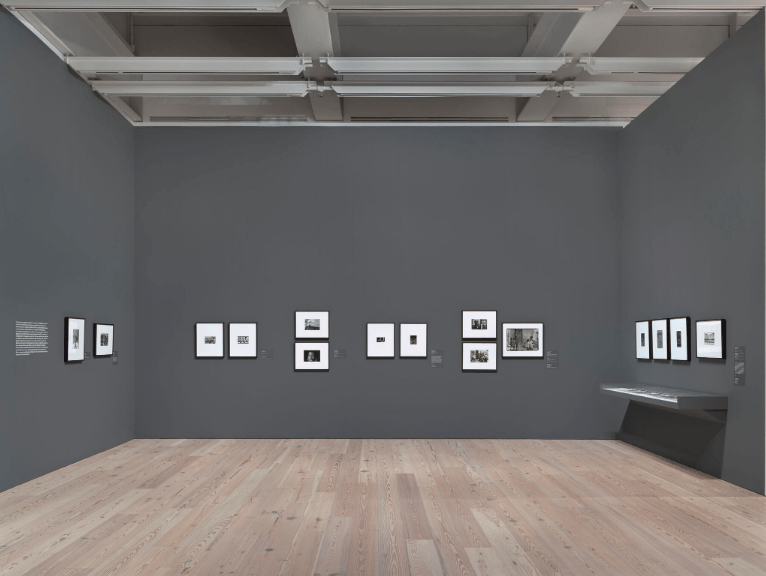 Installation view of Working Together: The Photographers of the Kamoinge Workshop (Whitney Museum of American Art, New York, November 21, 2020–March 28, 2021). From left to right: Louis H. Draper, Girl and Cuba (Philadelphia), 1968; C. Daniel Dawson, Olaifa and Egypt, 1978; Shawn Walker, Women in the Field, Cuba, 1968; Shawn Walker, Boys with Cups, Cuba, 1968; Herb Robinson, Brother & Sister, 1973; Herb Robinson, Shelly, 1965; Herb Robinson, Bus Stop, Kingston, Jamaica, 1973; Herb Robinson, Robin (Jamaica), 1973; Louis H. Draper, (Cinema Poster), Dakar Senegal, West Africa, 1978; Anthony Barboza, Fadiouth, Senegal, 1972; Ming Smith, Onlookers, Isle de Gorée, Senegal, c. 1972; James M. Mannas Jr., Bag Ladies, Matthews Ridge, Guyana, 1972; James M. Mannas Jr., Peeping Seawall Beach Boy-Sea Wall, Georgetown, Guyana, 1972; James M. Mannas Jr., Recess, Bishops All Girls High School, Georgetown, Guyana, 1973; Herman Howard, Guyana, 1970s. Photograph by Ron Amstutz