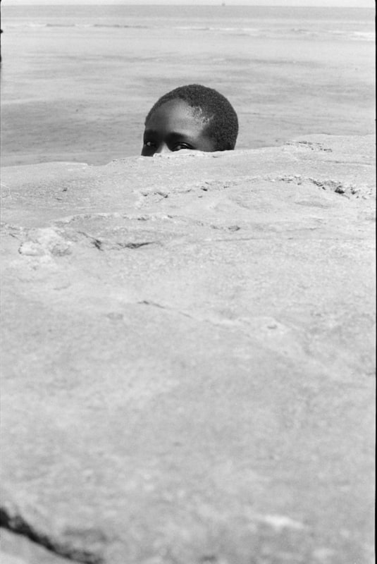 Jimmie Mannas ; Peeping Sea Wall Beach Boy, Sea Wall, Georgetown, Guyana, 1972 ; Bruce Silverstein Gallery