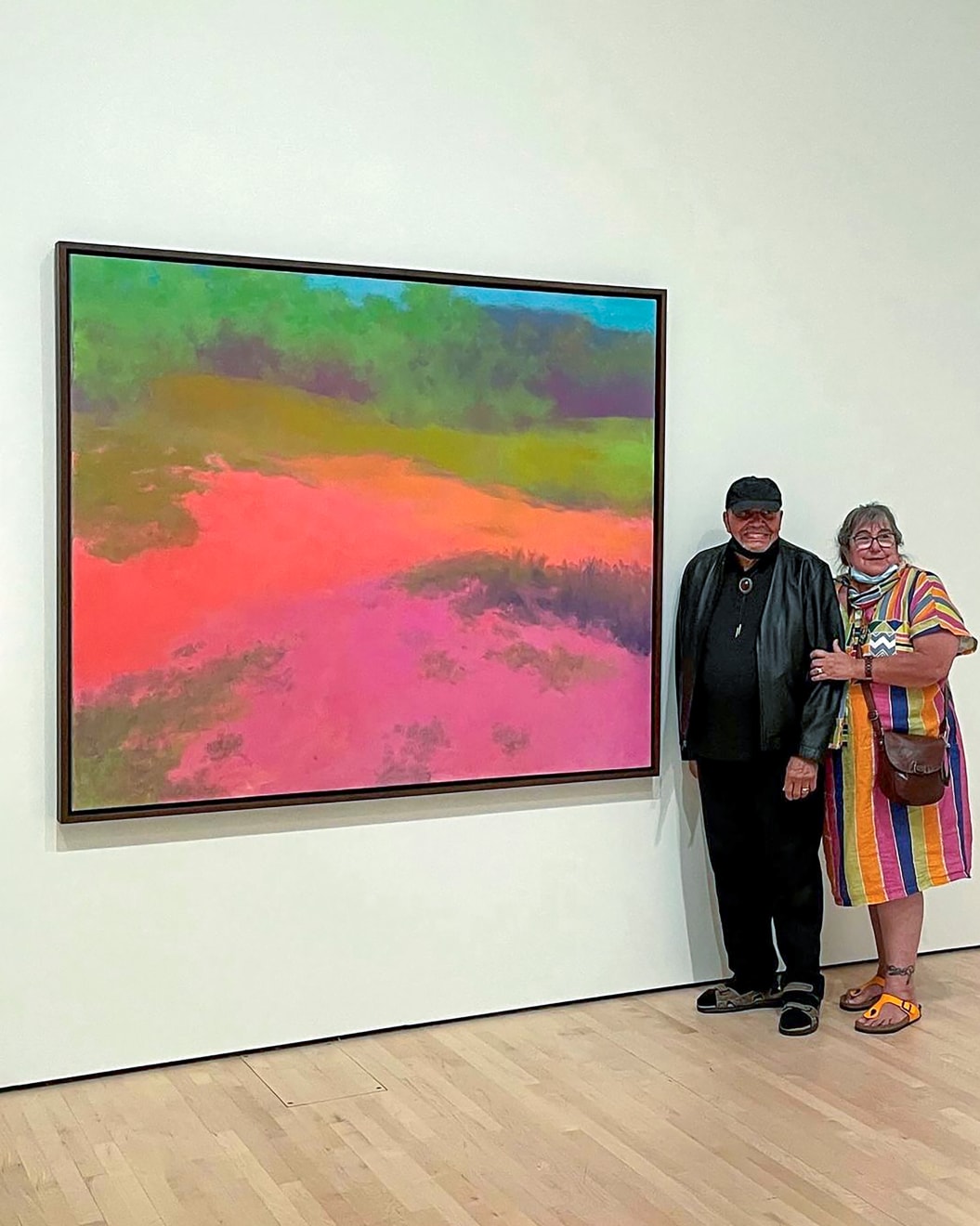 Artist Richard Mayhew poses with his wife Rosemary next to his 2004 painting &ldquo;Pamela&rsquo;s Aura,&rdquo; during a visit to SFMOMA for his 97th birthday.