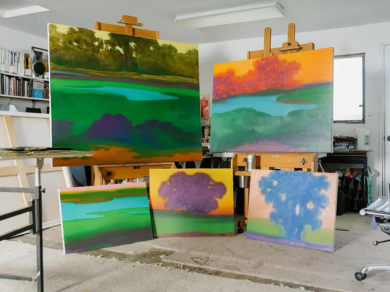 Five paintings by Richard Mayhew in his studio