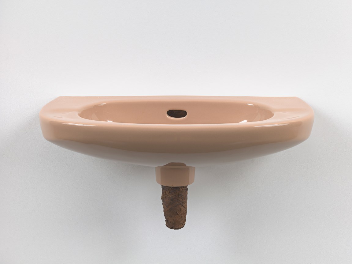 Plug, 2018. Ceramic sink, hand-rolled cigar,