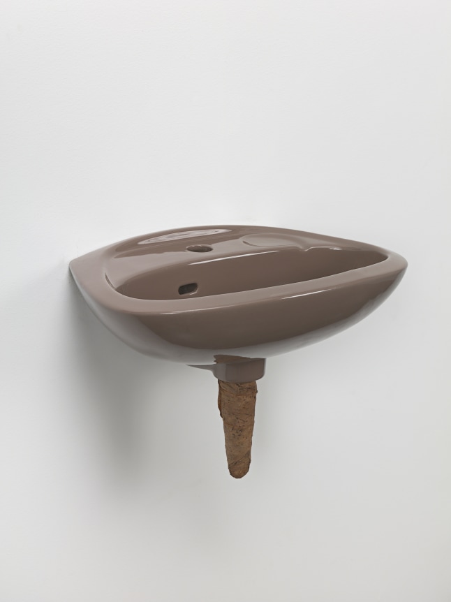 Plug, 2018. Ceramic sink, hand-rolled cigar,