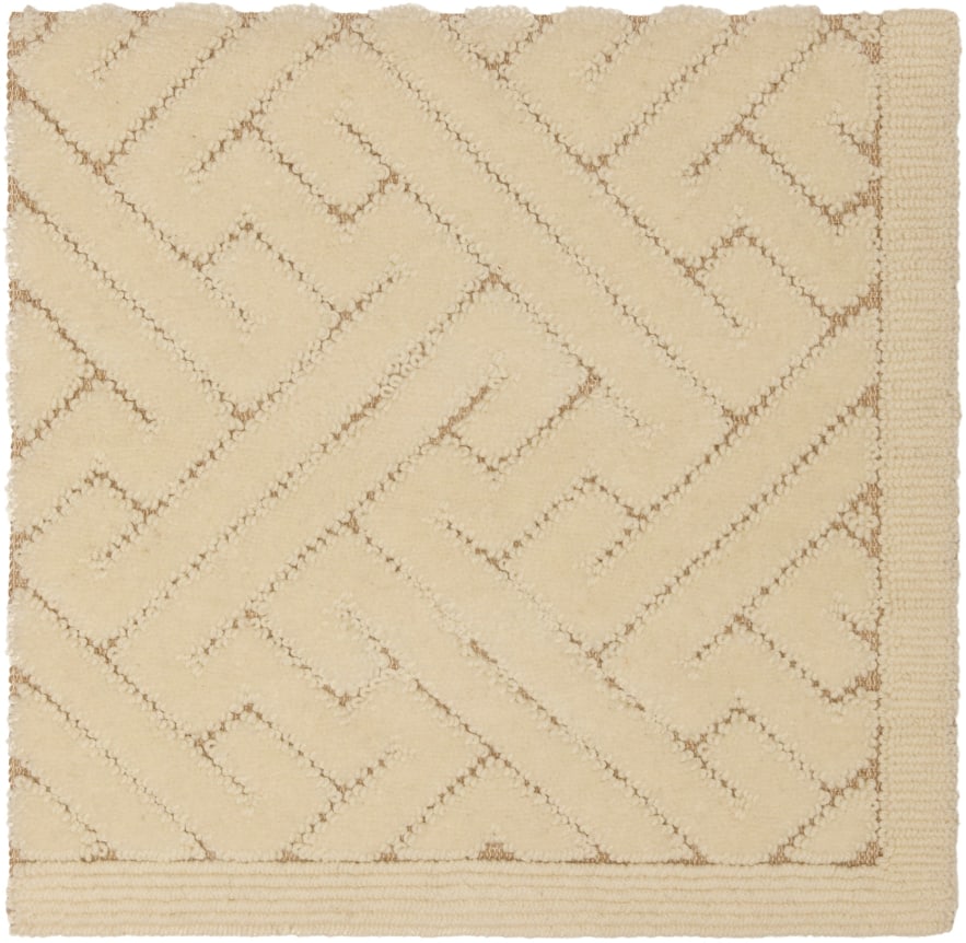 glora 2' x 2' flatweave sample in the ivory colorway. despite being called a flatweave, it contains cute pile