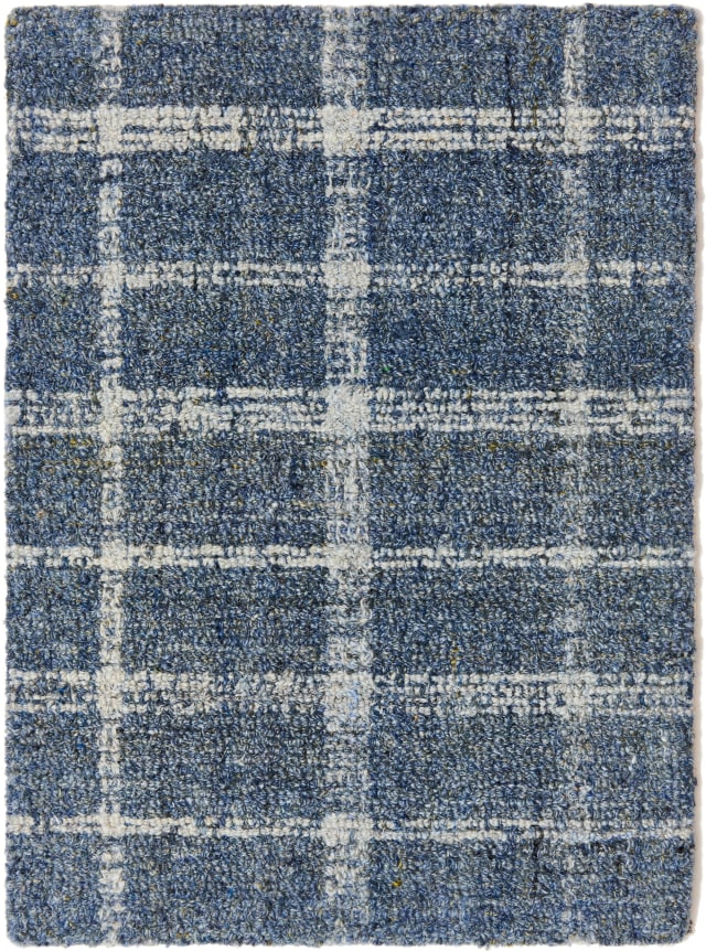 alpine sample in the denim colorway. the plaid pattern is cream contrasting with a denim blue background