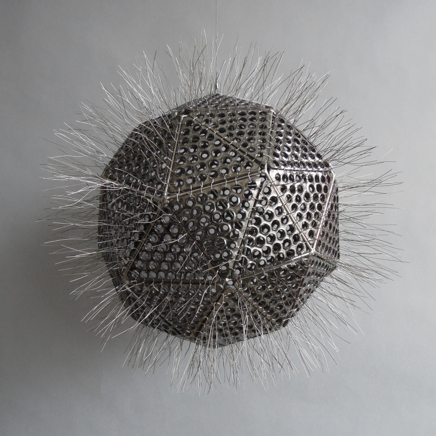 Chris Garofalo.&nbsp;dijatoma,&nbsp;2020. Glazed porcelain, chrome frame, stainless steel wire, 14 x 14 x 14 inches.&nbsp;