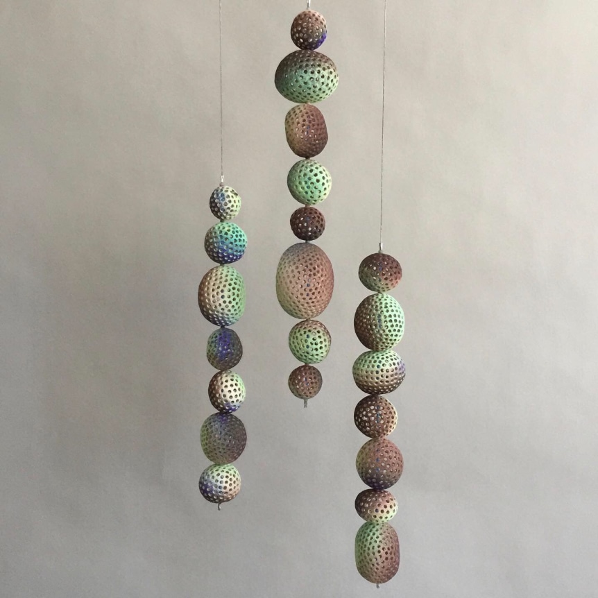 Chris Garofalo.&nbsp;t&uuml;hi kest, 2020. Glazed porcelain, indian agate and glass beads, 15-13 x 3 x 3 inches, each.&nbsp;